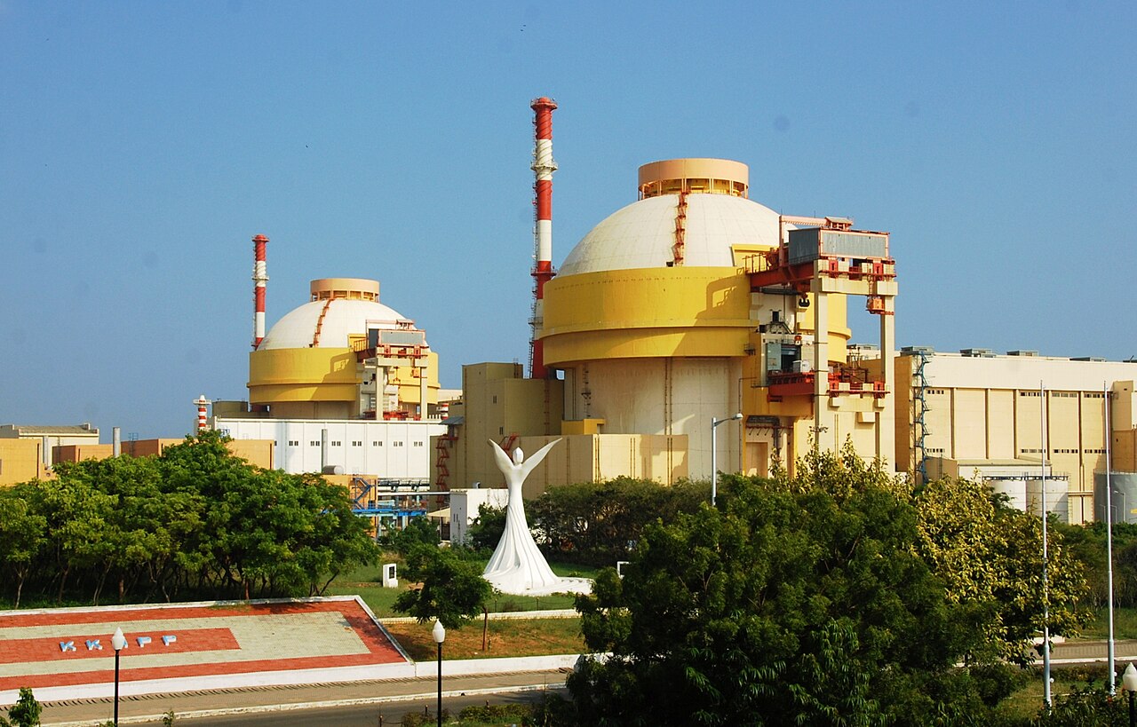 The two domed containment buildings of Kudankulam Nuclear Power Plant against an evening sky.